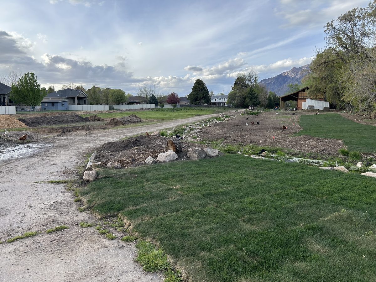 Wide view of Sunnie Springs Farm with Utah mountains
